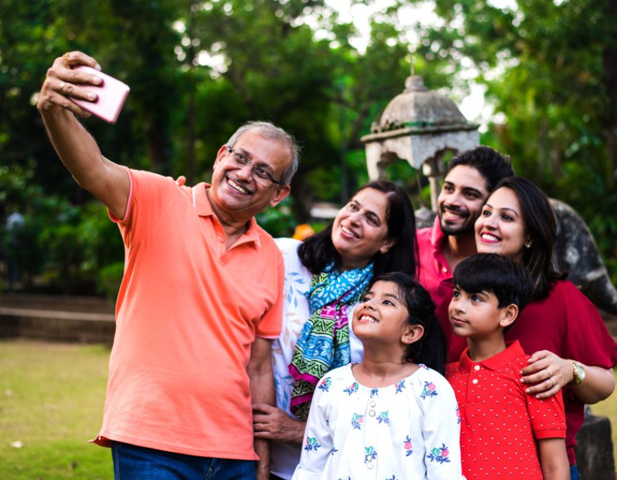 indian-grandfather-taking-selfie-multi-generation-asian-family-six-capturing-family-photograph-smartphone-while-standing-garden-park